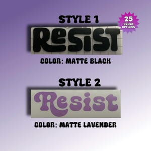 May include: Two rectangular vinyl decals featuring the word Resist in different fonts. Style 1 displays the text in matte black on a grid background. Style 2 displays the text in matte lavender. A starburst graphic indicates 25 color options.