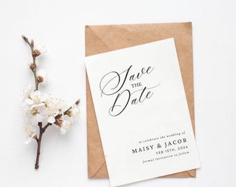 May include: A white save the date card with black calligraphy that reads "Save the Date" and the text "to celebrate the wedding of Maisy & Jacob Feb 13th, 2026 formal invitation to follow".