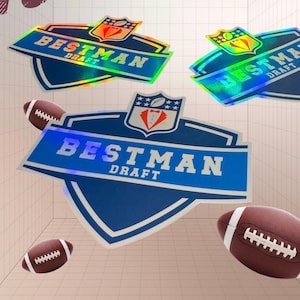 May include: A collection of blue and holographic stickers with the text "BESTMAN DRAFT" and footballs. The stickers have a shield shape with a crest design. The footballs are brown with white stripes.