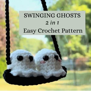 May include: A crochet ghost swing featuring two white ghosts with black eyes and pink cheeks. The swing is black and hangs from a black rope. The image includes text that reads "SWINGING GHOSTS 2 in 1 Easy Crochet Pattern."