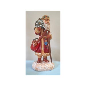 Hand carved Santa Claus wood carving with tree