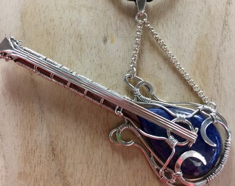 SOLD. Guitar Wire Wrapped Pendant Necklace Blue Lapis