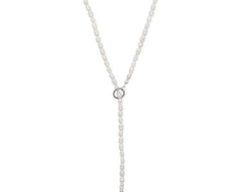 May include: A delicate white pearl lariat necklace. The necklace features a strand of small, oval-shaped pearls that form a Y-shape. A silver-toned circular pendant with a pearl accent connects the two strands. The necklace is designed to be worn long.