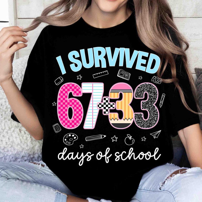 May include: Black t-shirt with the text "I SURVIVED 67:33 days of school" in a playful font. The numbers are decorated with patterns and school-themed graphics. A fun and celebratory design for students.