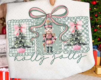 ヒイラギジョリーセージ、ピンクのプレッピークリスマスくるみ割り人形PNG、コケットリボンホリデーデザイン、シャツ用のキュートなガーリークリスマスパステル水彩デザイン