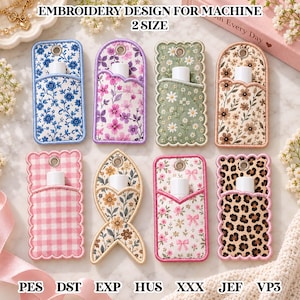 May include: Eight embroidered lip balm holders in various patterns including blue floral, purple floral, green daisy, brown floral, pink gingham, fish-shaped floral, pink floral with bows, and leopard print, each featuring a metal eyelet and white tube.