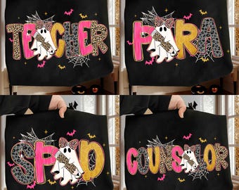 May include: Black tote bags with Halloween-themed designs. Each bag features a different title: "TEACHER", "PARA", "SPED", and "COUNSELOR". The text is in pink, gold, and leopard print, with a ghost and spiderweb graphic.