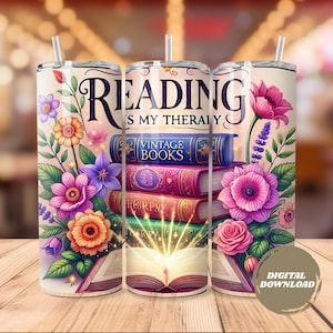 May include: A floral tumbler with the text "Reading is my therapy" and a stack of vintage books. The design features colorful flowers in pink, purple, and orange, with a straw and a digital download label.