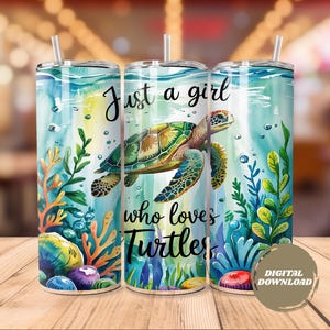 May include: Three stainless steel tumblers with a sea turtle design. The tumblers feature an underwater scene with a green and brown sea turtle, coral, and the text "Just a girl who loves Turtles". The tumblers have a straw and a lid.