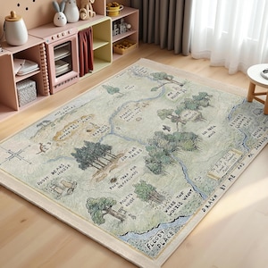 May include: A beige and green rug with a map of the Hundred Acre Wood from Winnie the Pooh. The map features various locations like Pooh Bear's House, Piglet's House, and the Six Pine Trees. The text "Drawn by Me and Mr. Shepard" is at the bottom right corner.