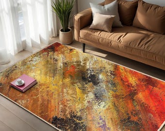 May include: Abstract area rug with a colorful design featuring shades of yellow, orange, red, and brown. The rug has a distressed, textured look.