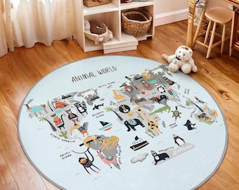 May include: A round, blue and gray play rug with a world map design. The map features various animals and the text "Animal World".