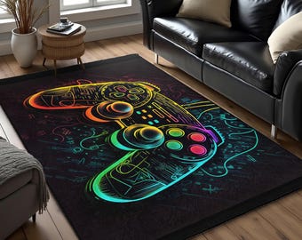 Könnte beinhalten: Schwarzer rechteckiger Teppich mit einem neongefärbten Videospiel-Controller-Design. Der Controller ist in leuchtenden Farben wie Gelb, Orange, Grün und Pink umrandet. Der Teppich hat einen dunklen Hintergrund mit abstrakten Formen.