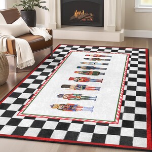 May include: A white and black checkered rug with a red border and a white center featuring a line of colorful nutcracker figurines. The rug has a candy cane design along the border.