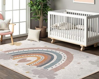 May include: A white crib with a rainbow-themed rug featuring a colorful rainbow with clouds and polka dots. The rug is on a wooden floor.