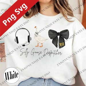 May include: White sweatshirt with a graphic design featuring a headset, a goose, and a black bow with "911" on it. The text "Silly Goose Dispatcher" is also included. The design is in black and white.