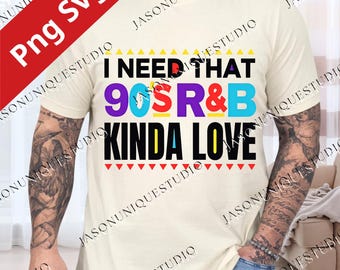 May include: Cream-colored t-shirt with the text "I NEED THAT 90S R&B KINDA LOVE" in a colorful design. The shirt features a crew neck and short sleeves. The text is in various colors including purple, blue, and yellow.