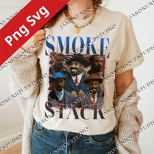 May include: Beige t-shirt featuring a graphic design with the words "SMOKE STACK" in blue and burgundy, with images of several men. The shirt has a crew neck and short sleeves. The image has a red "Png Svg" graphic in the upper left corner.