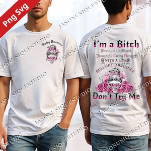 May include: White t-shirt with a graphic on the front and back. The front graphic says "Baby Boomer" with a skull wearing sunglasses. The back graphic says "I'm a Bitch" with additional text and a skull design.