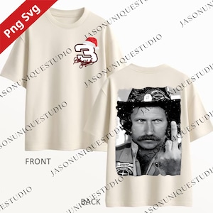 May include: Cream-colored t-shirt featuring a front design with the number 3 in red and a Santa hat, along with a signature. The back of the shirt displays a black and white image of a man with a mustache and a gesture.