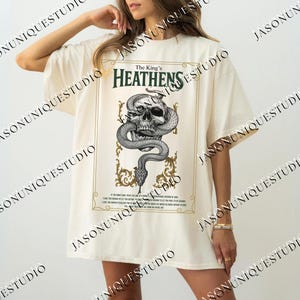 a woman wearing a t - shirt with a snake on it