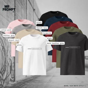 May include: A selection of short-sleeved t-shirts in colours such as white, black, and pink. Each shirt has a printed design and the text "/prompt". The shirts are displayed against a neutral background, showcasing the range of available colours.
