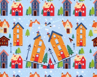 May include: A light blue background features a repeating pattern of colorful houses, evergreen trees, and street lamps. Two gift tags with a house design are in the foreground. The houses are orange, red, blue, and brown.