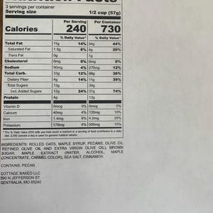 May include: Nutrition facts label for Maple Pecan Granola with serving size of 1/2 cup (57g). The label lists calories, total fat, saturated fat, trans fat, cholesterol, sodium, total carbohydrate, dietary fiber, total sugars, protein, vitamin D, calcium, iron, and potassium. The ingredients include rolled oats, maple syrup, pecans, olive oil, brown sugar, maple extract, sea salt, and cinnamon.