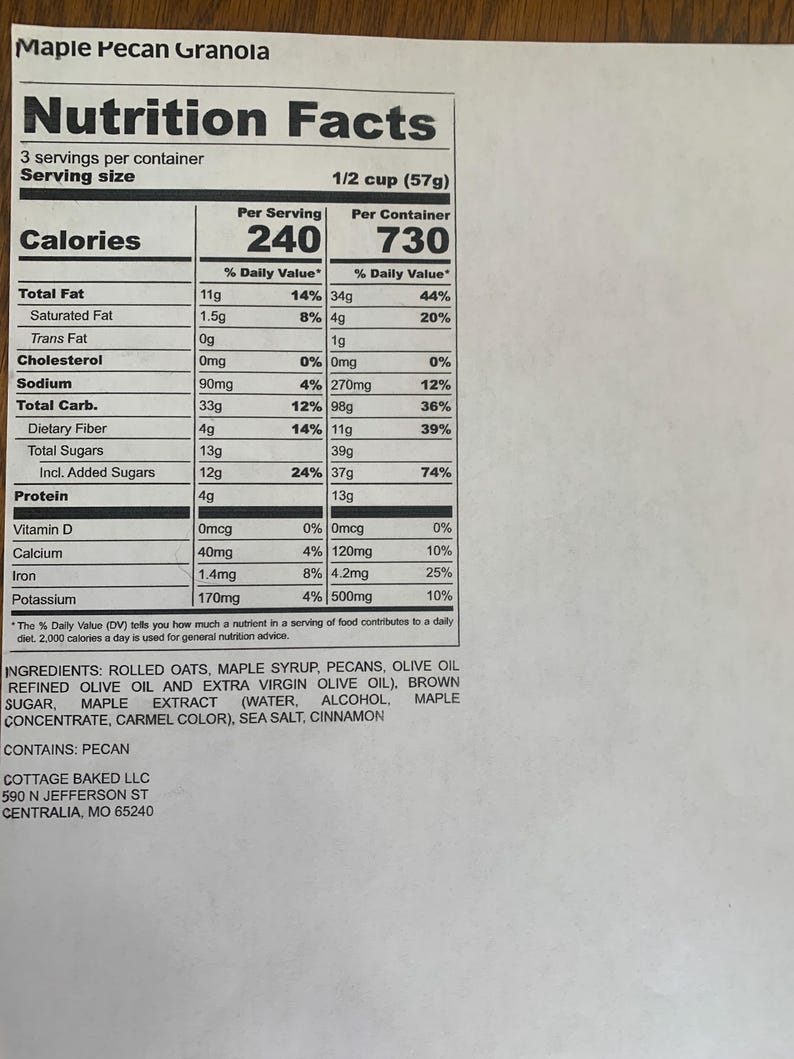 May include: Nutrition facts label for Maple Pecan Granola with serving size of 1/2 cup (57g). The label lists calories, total fat, saturated fat, trans fat, cholesterol, sodium, total carbohydrate, dietary fiber, total sugars, protein, vitamin D, calcium, iron, and potassium. The ingredients include rolled oats, maple syrup, pecans, olive oil, brown sugar, maple extract, sea salt, and cinnamon.