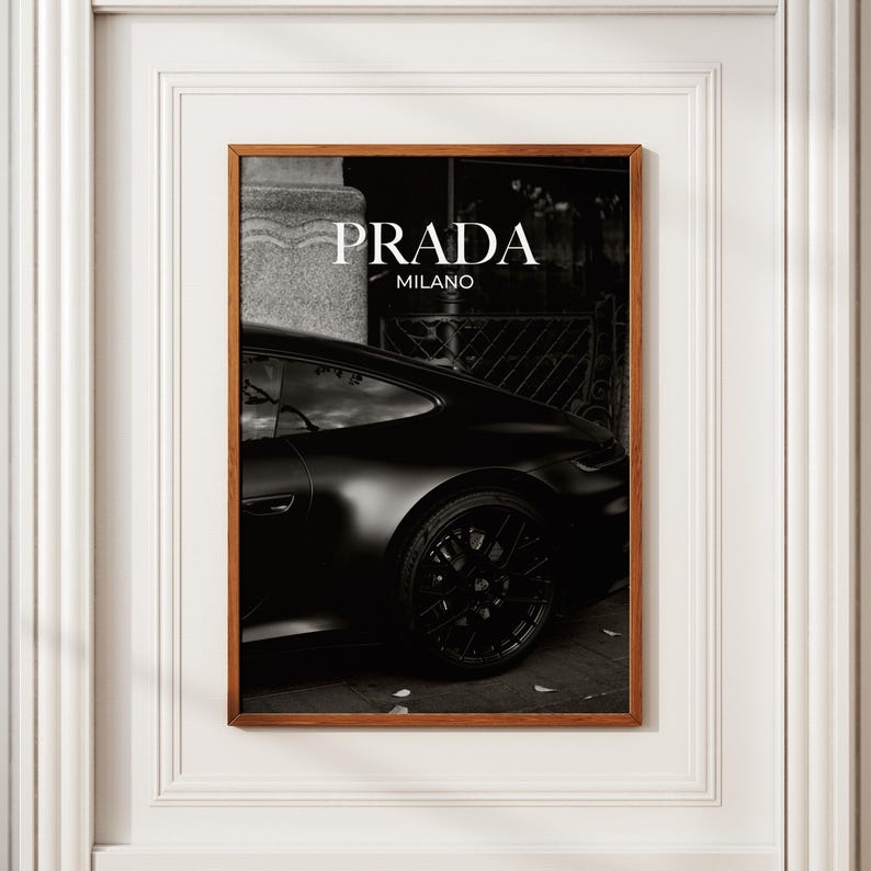 Old money fashion style black-and-white Porsche artwork with Prada-inspired text, creating a moody luxury aesthetic. This elegant print is ideal for old money prints, old money aesthetic décor, and upscale fashion poster displays. Perfect for lovers of luxury prints, luxury car poster décor, and designer interiors seeking prada fashion inspired poster styling and dark elegance minimalist fashion home decor accents.