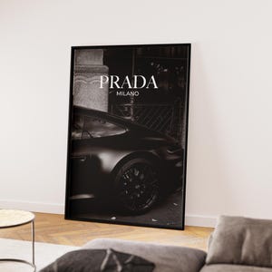 Old money fashion style black-and-white Porsche artwork with Prada-inspired text, creating a moody luxury aesthetic. This elegant print is ideal for old money prints, old money aesthetic décor, and upscale fashion poster displays. Perfect for lovers of luxury prints, luxury car poster décor, and designer interiors seeking prada fashion inspired poster styling and dark elegance minimalist fashion home decor accents.