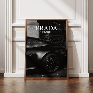 Old money fashion style black-and-white Porsche artwork with Prada-inspired text, creating a moody luxury aesthetic. This elegant print is ideal for old money prints, old money aesthetic décor, and upscale fashion poster displays. Perfect for lovers of luxury prints, luxury car poster décor, and designer interiors seeking prada fashion inspired poster styling and dark elegance minimalist fashion home decor accents.