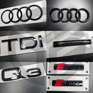 May include: Black and silver car emblems with the text "TDI", "Q3", "S line", and "quattro".