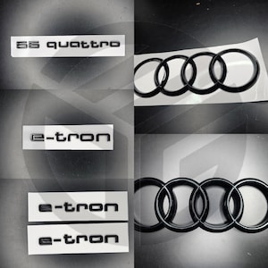 Puede incluir: Emblemas de coche en blanco y negro con el texto "55 quattro" y "e-tron".