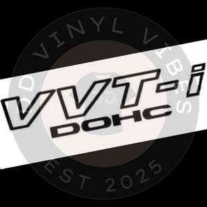 May include: Black and white vinyl decal with the text "VVTi-DOHC" in a bold, stylized font.