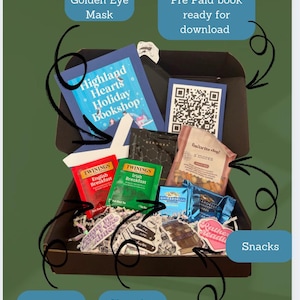 May include: A brown box filled with a variety of items, including tea bags, chocolate bars, snacks, stickers, and a book. The box is labelled "Blind Date Box" and includes a QR code. The items are arranged in a visually appealing way.