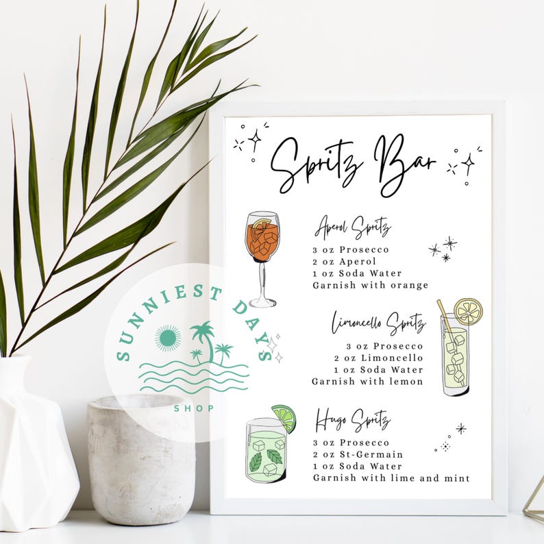 Peut inclure: Une affiche encadr&eacute;e avec le texte "Spritz Bar" et des recettes de cocktails. Les recettes incluent Aperol Spritz, Limoncello Spritz et Hugo Spritz. L'affiche est d&eacute;cor&eacute;e d'illustrations des cocktails et de leurs garnitures.