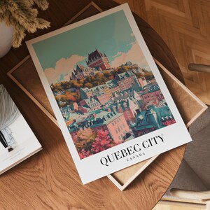 May include: A vintage-style travel poster featuring a colorful illustration of Quebec City, Canada. The poster depicts the cityscape with a prominent castle-like structure on a hilltop, surrounded by buildings and trees.