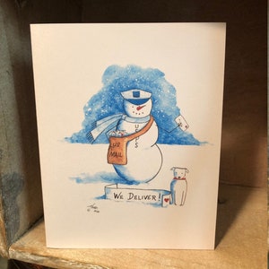 May include: A watercolor illustration of a snowman wearing a blue hat and scarf, holding a bag of mail that says "US Mail". The snowman is standing on a banner that says "We Deliver!" with a red heart. A white dog is standing next to the snowman.