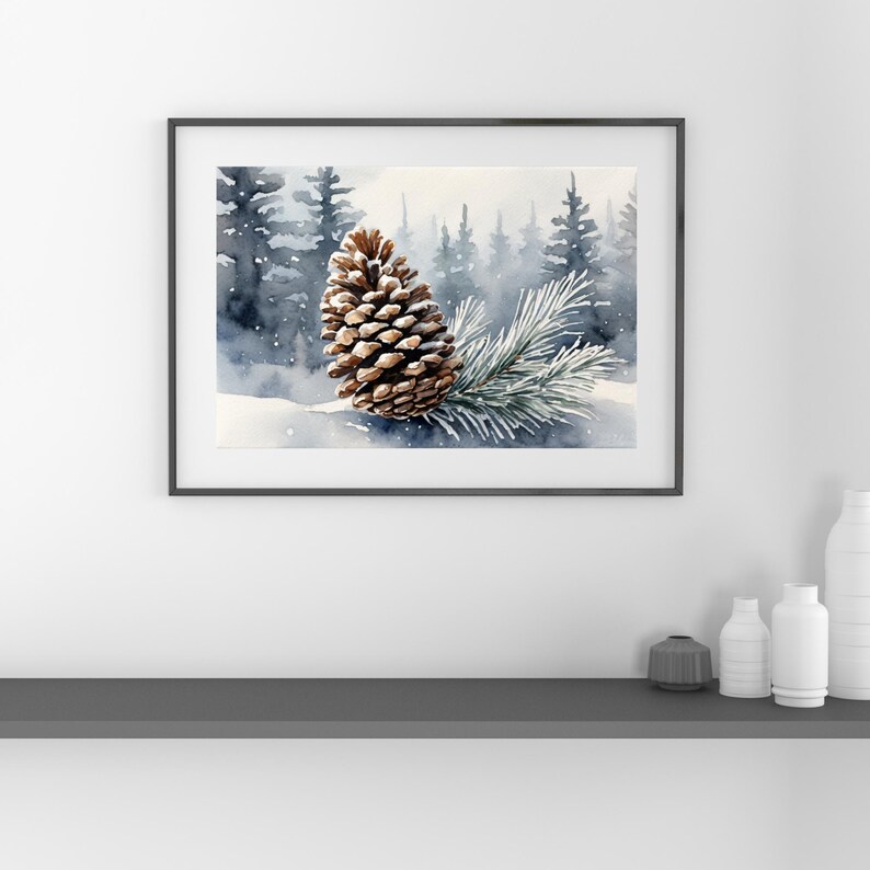 May include: Watercolor painting of a pine cone and a pine branch on a snowy surface, set against a backdrop of a misty forest. The artwork is framed in a black frame, evoking a serene winter scene.