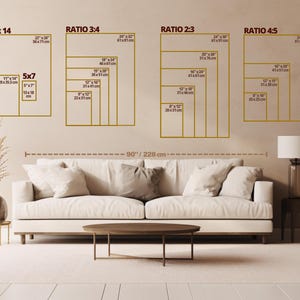 May include: A diagram showing different print sizes for canvas prints. The sizes are listed in inches and centimeters. The diagram shows a couch and a table in front of a wall with the print sizes displayed.