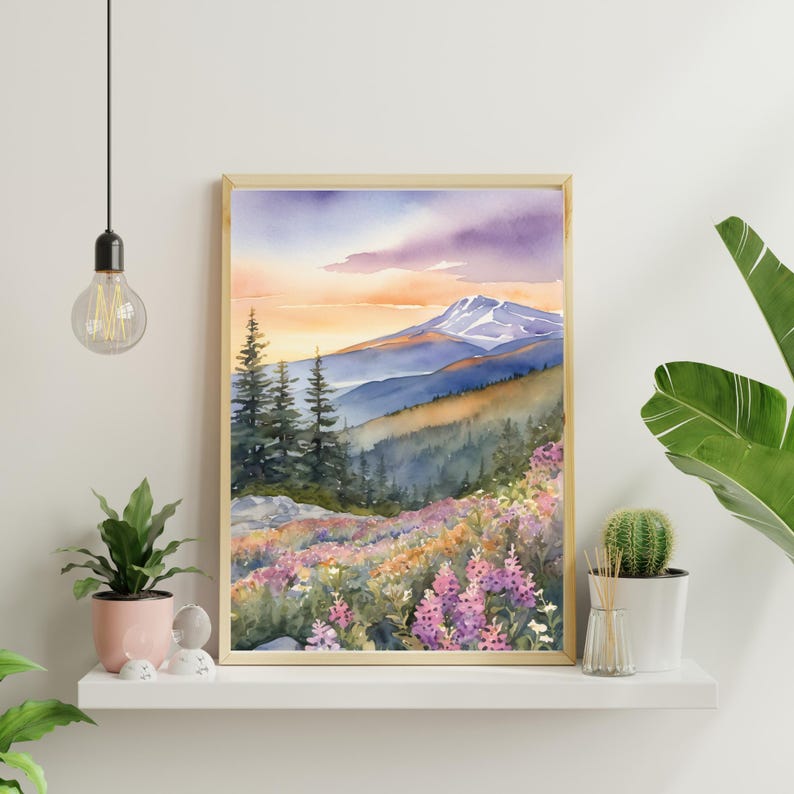 May include: Watercolor painting of a mountain range with a sunset sky. The mountains are covered in trees and wildflowers. The sky is a mix of purple, pink, and orange.