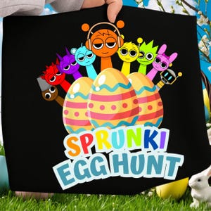 May include: Black tote bag featuring a colorful graphic of cartoon characters with Easter eggs. The text "SPRUNKI EGGHUNT" is displayed in a playful font. The design includes orange, yellow, pink, blue, and green colors.