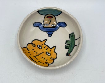 Hand painted shallow 4 1/2"ceramic bowl- yellow cat, person, bird