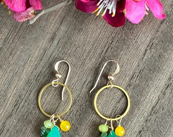 Gold filled hoop earrings with green and yellow semiprecious stones.
