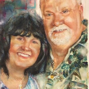 May include: A watercolor painting of a couple, a woman with dark hair and a man with a white beard, smiling at the camera. The man is wearing a light green shirt with a floral pattern. The woman is wearing a light blue shirt with a white necklace. The painting is signed "B.S. 2016" in the bottom right corner.