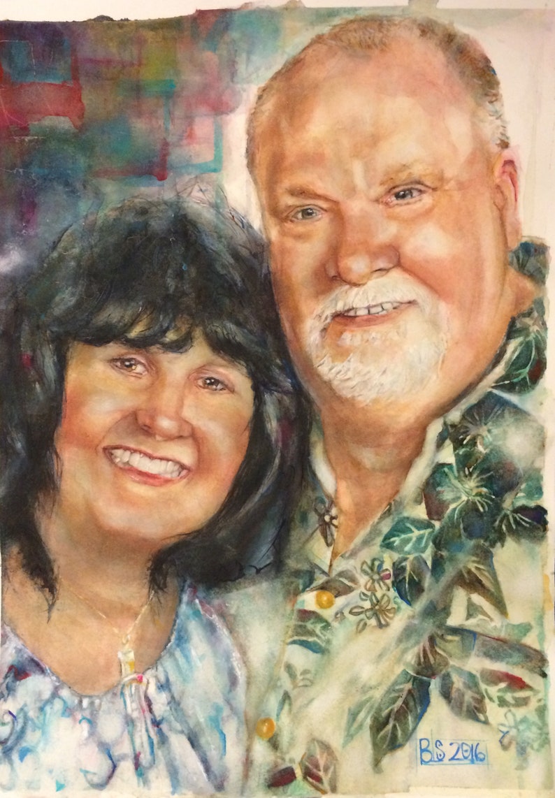 May include: A watercolor painting of a couple, a woman with dark hair and a man with a white beard, smiling at the camera. The man is wearing a light green shirt with a floral pattern. The woman is wearing a light blue shirt with a white necklace. The painting is signed "B.S. 2016" in the bottom right corner.