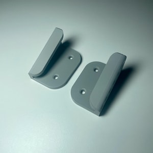 grey mounts shown on a white desk