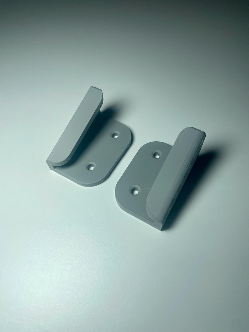 grey mounts shown on a white desk