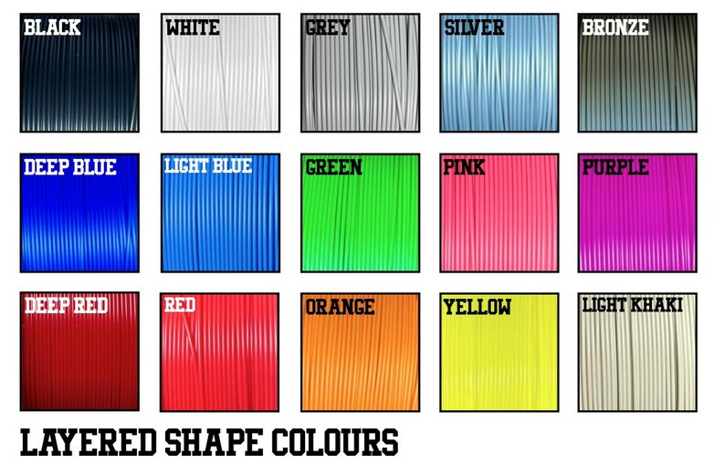 May include: A chart showing 15 different colors of filament for 3D printing. The colors are: black, white, grey, silver, bronze, deep blue, light blue, green, pink, purple, deep red, red, orange, yellow, and light khaki.